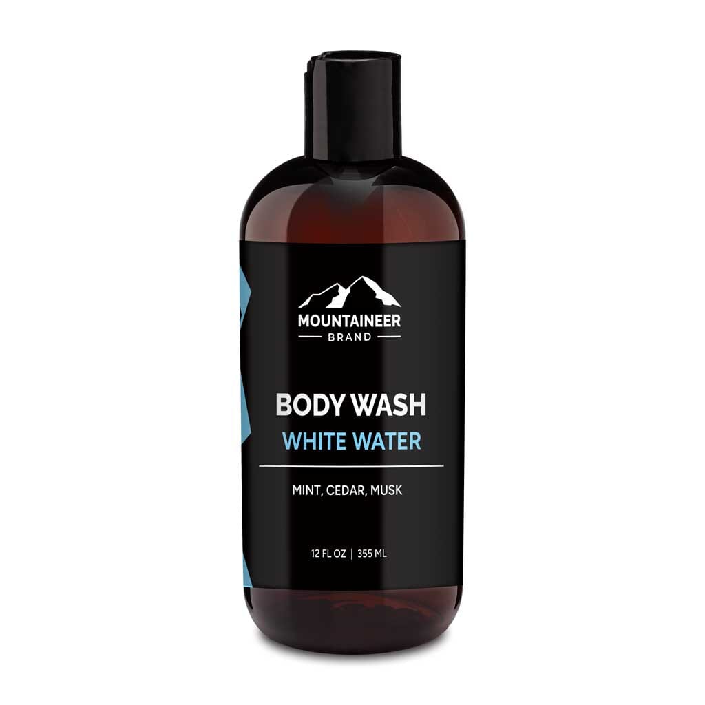 A bottle of Mountaineer Brand Products Natural Men's Body Wash labeled "white water" with mint, cedar, and musk scents, 12 fl oz (355 ml).