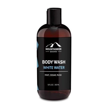 A bottle of Mountaineer Brand Products Natural Men's Body Wash labeled "white water" with mint, cedar, and musk scents, 12 fl oz (355 ml).